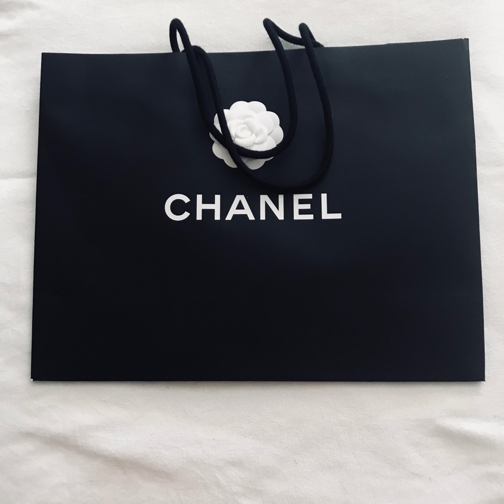 Chanel large empty shopping bags.